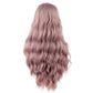 Women's long curly wig, back view with voluminous dusty rose pink waves