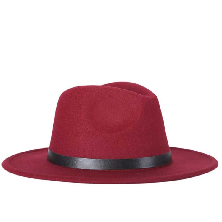 Wine red fedora hat with black band and buckle, wide brim, wool-blend jazz style.