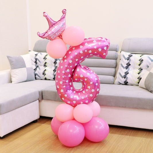 Pink polka-dot foil number balloon with crown topper and pink balloon base
