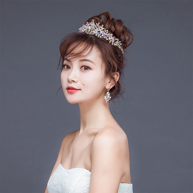 Pink crystal bridal tiara on hair with matching drop earrings