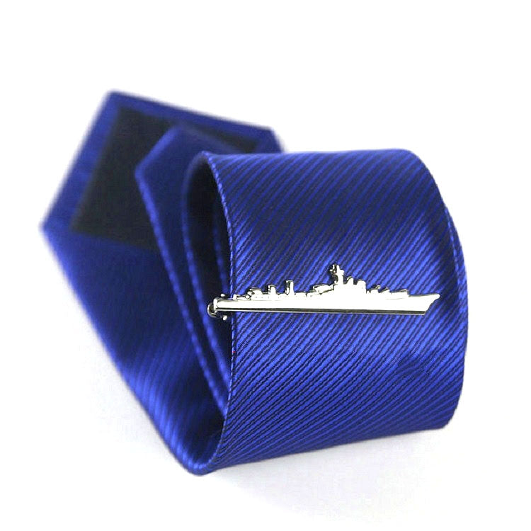 Silver warship tie clip on blue striped necktie, with matching box behind