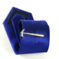 Gold hammer tie clip on blue striped necktie, shown with gift box