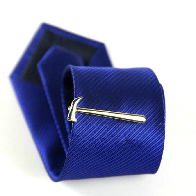 Gold hammer tie clip on blue striped necktie, shown with gift box