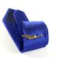Gold dolphin tie clip on blue striped necktie, shown with gift box