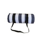 Rolled outdoor camping mat with dark navy and white vertical stripe pattern, with black straps