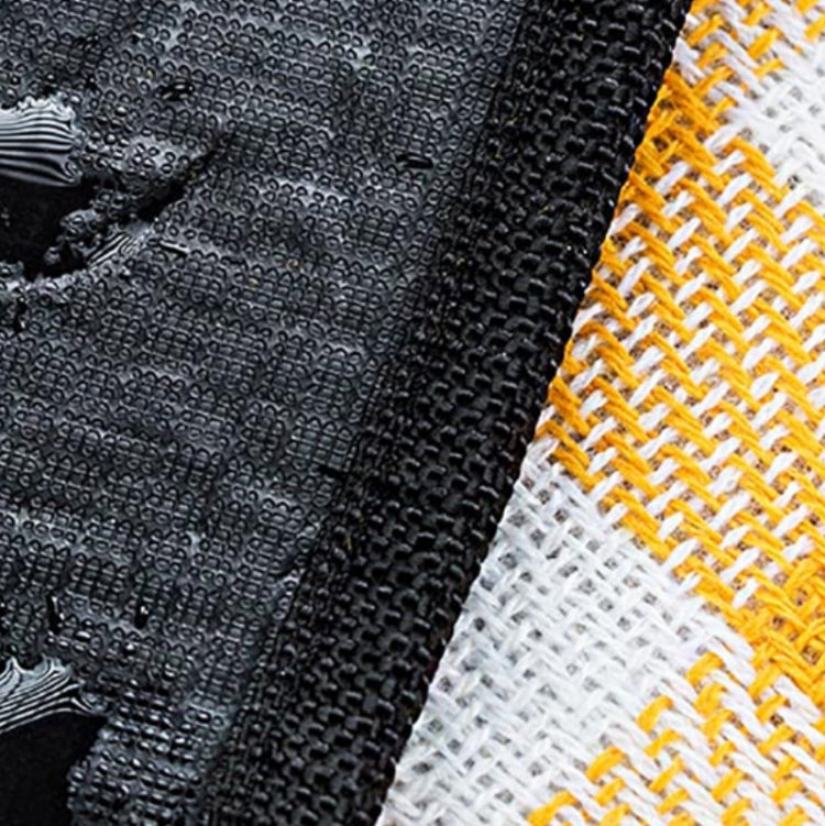 Thick outdoor beach mat with black textured surface and white-yellow woven edge