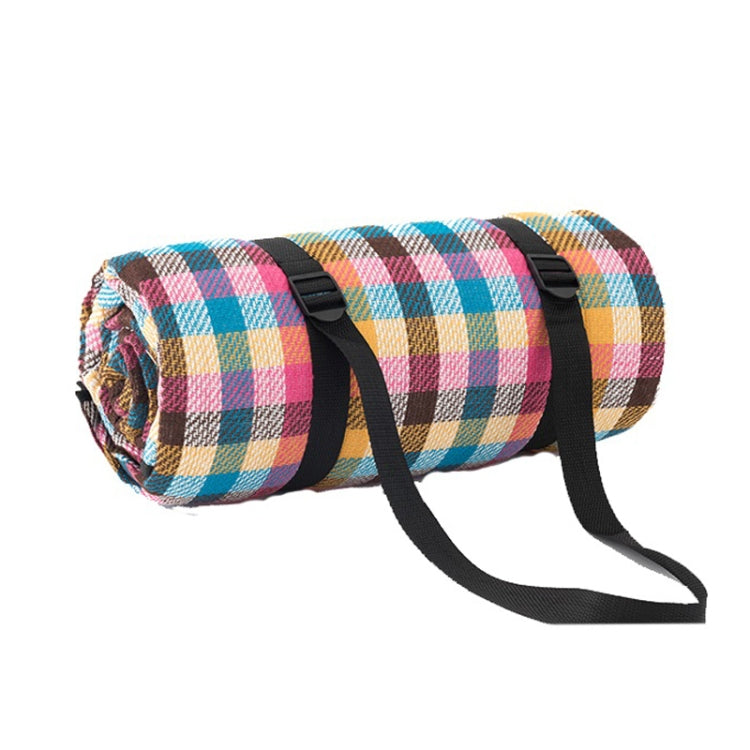 Multicolor checkered beach mat roll with black carrying straps