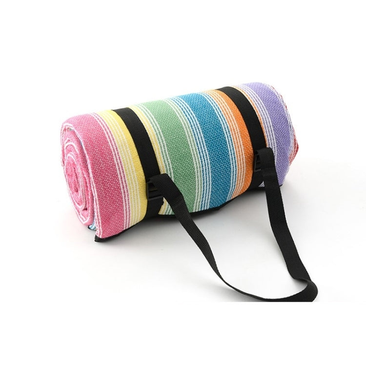 Pastel multicolor striped beach mat roll with black carrying straps