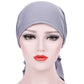 Light gray curved wrap cap turban hat with long side tie tail, snug headband fit