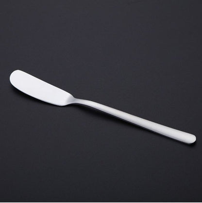 Butter knife with silver finish, rounded tip and smooth spreader blade.