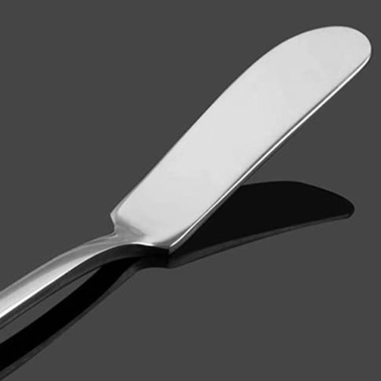 Silver butter knife head with smooth, curved spreader surface and rounded tip.