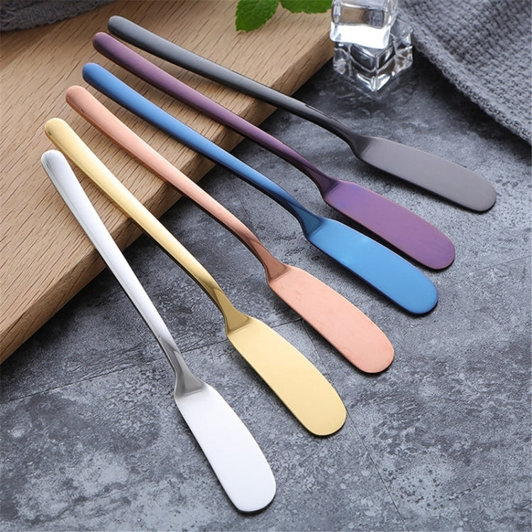 Assorted colored butter knife set with curved spreader blades and smooth handles.