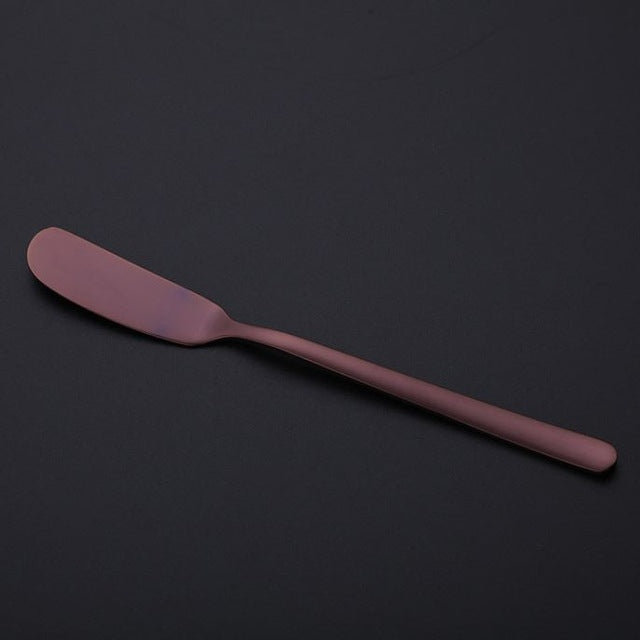 Purple butter knife with a smooth rounded spreader blade and slim long handle.