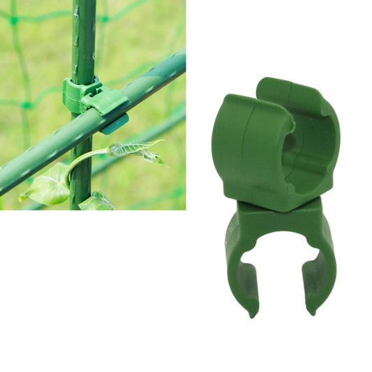 Green plastic tube clamp bracket with rotary buckle and two prongs for poles
