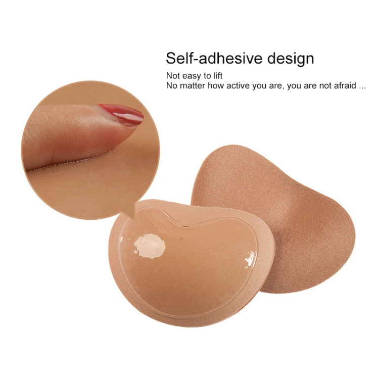 Skin-tone self-adhesive silicone nipple covers with protective backing visible.