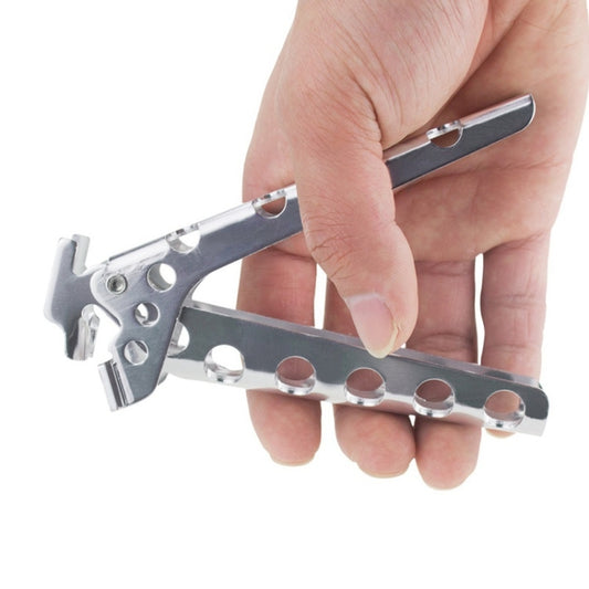 Stainless steel pot handle gripper with spring clamp, held in hand