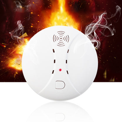 White circular wireless smoke detector with speaker grille and small red status LED