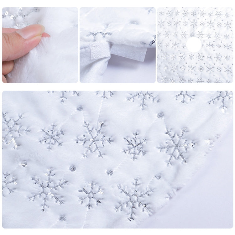 Plush tree skirt with silver-toned snowflake sequin embroidery and stitched edge