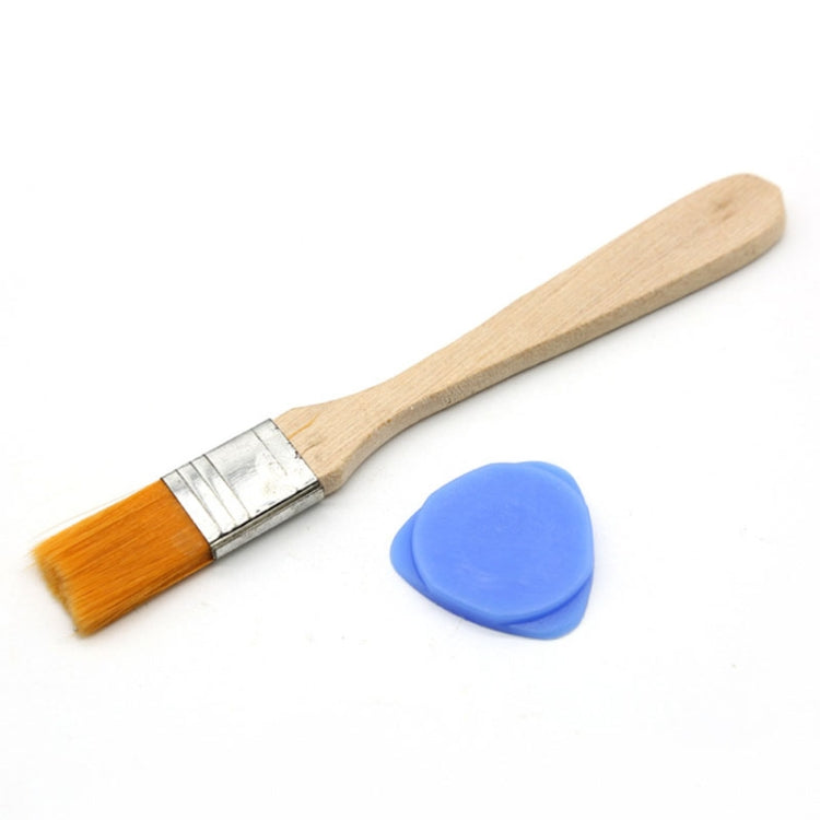 Flat paint brush with wooden handle, silver ferrule, and blue plastic guitar pick