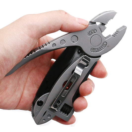 Multi-function camping pliers with black handles, silver jaws and wrench head, held in hand