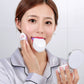 U-shaped electric toothbrush in white; person holds device near mouth