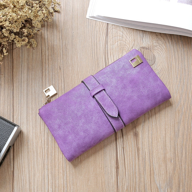 Purple suede-style long wallet phone bag with zip, wrap flap strap, and gold-tone clasp.