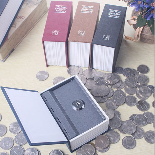 Opened dictionary safe box with coins and metal lock compartment