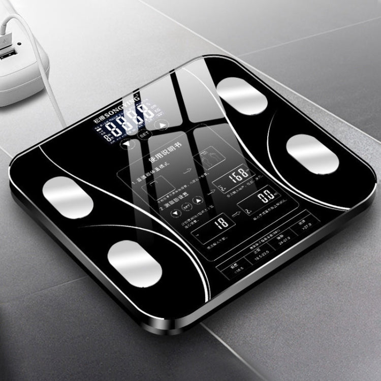 Black digital bathroom weighing scale with large LCD display and four corner electrodes