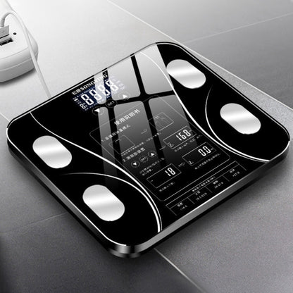 Black digital bathroom weighing scale with large LCD display and four corner electrodes