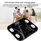 Black digital bathroom scale with LCD screen and four sensor pads on platform