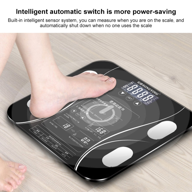 Black digital bathroom weighing scale with LCD screen and foot on sensor platform