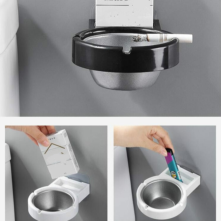 Wall-mounted split ashtray, black with gray insert and cigarette stub in bowl