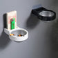 Wall-mounted ashtrays, white and black bowls; white one holds a cigarette