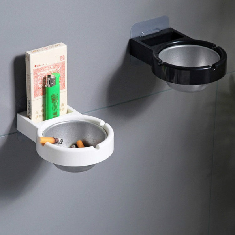 Wall-mounted ashtrays, white and black bowls; white one holds a cigarette