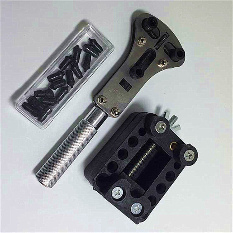 14-in-1 watch repair tool with black base plate, screw holes, silver handle, and small parts