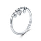 Sterling silver heart CZ ring with three heart charms in a polished band