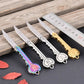 Mini key knife keychain set with several silver and gold open blades