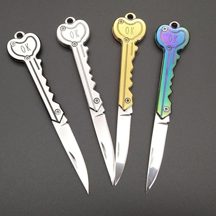Mini key knife keychain set with silver, gold, and rainbow handles and open blades