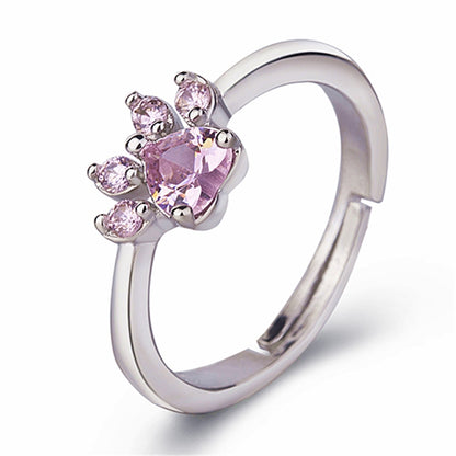 Adjustable cat-claw ring with pink crystal stones, silver-tone band