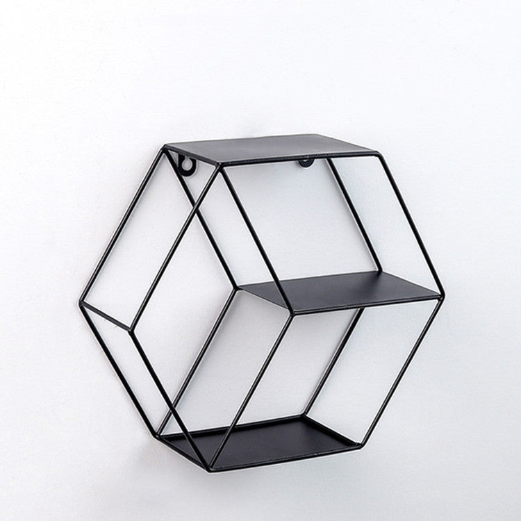 Black hexagonal wrought-iron hanging wall shelf with open grid tiers