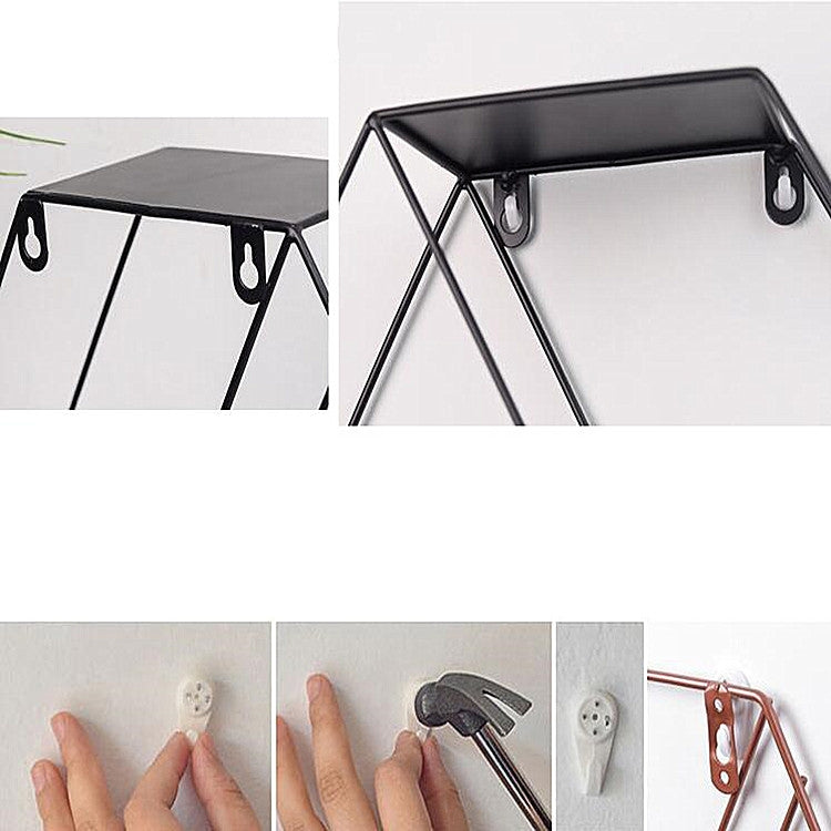 Black hexagonal wall shelf corner with hanging hooks on the top rim