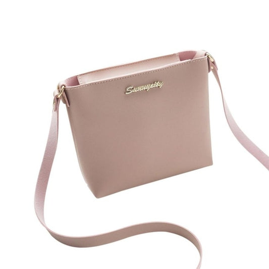 Pink women’s solid crossbody shoulder bag with top zipper and adjustable strap