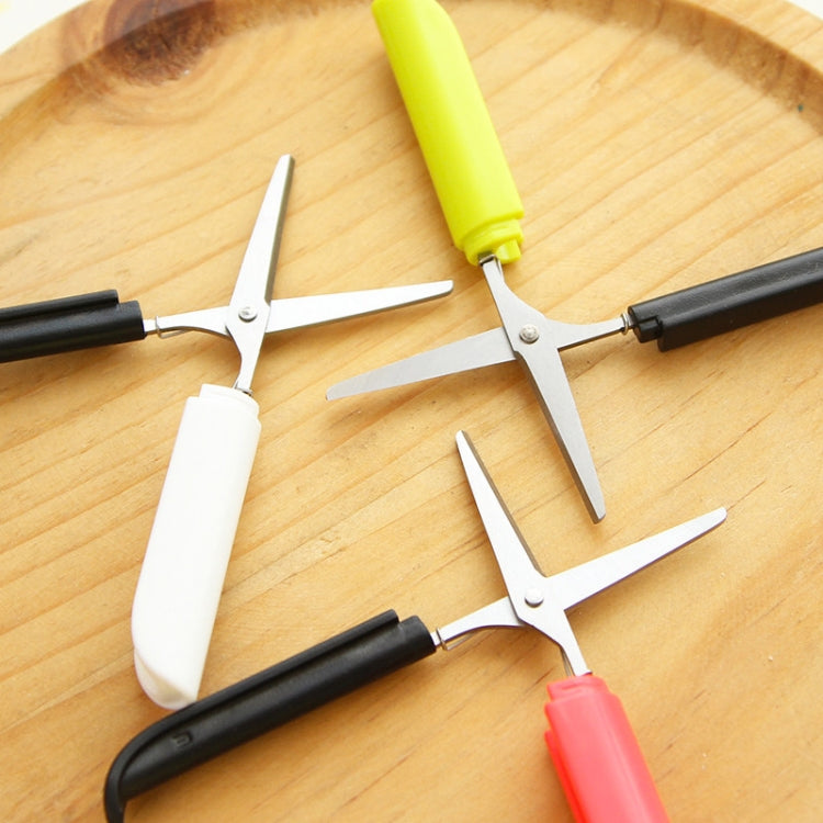 Folding mini scissors with lime, black, and red handles, shown with safety guards