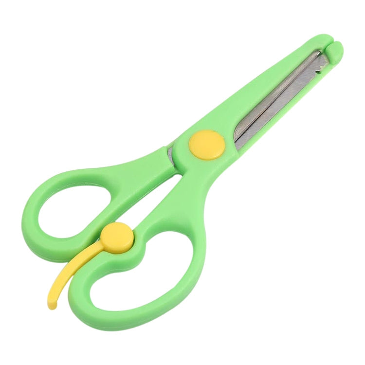 Green safety scissors with yellow accents and rounded tips, ergonomic loop handles