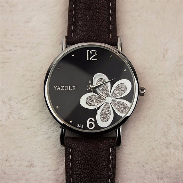 Ladies quartz wristwatch with four-leaf clover dial and black leather-look strap
