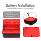 Red digital tilt meter with open battery compartment showing battery terminals.