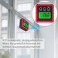 Red digital tilt meter with green LCD mounted by magnetic base on a metal frame.