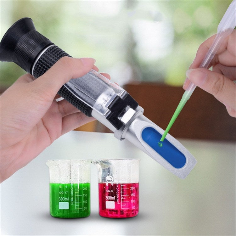 Hand-held alcohol refractometer with blue viewing window and green drop indicator