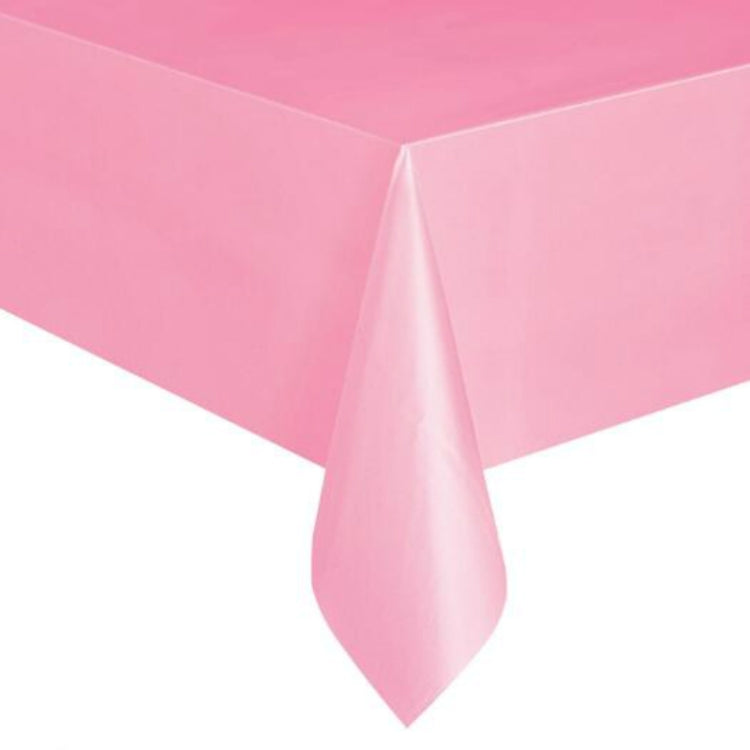 Disposable plastic tablecloth in solid pink, rectangular with hanging corner folds.