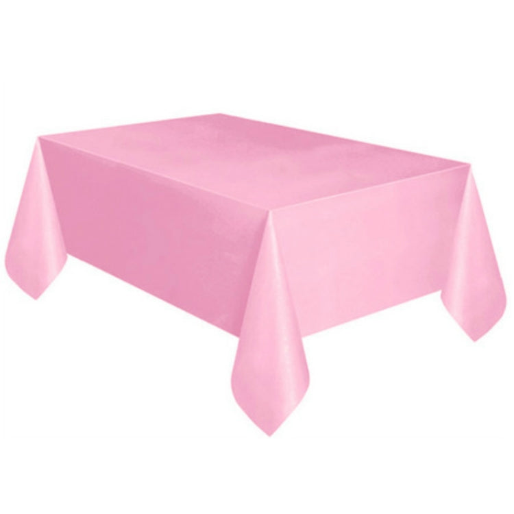 Disposable plastic tablecloth in solid light pink, rectangular with hanging corner drops.